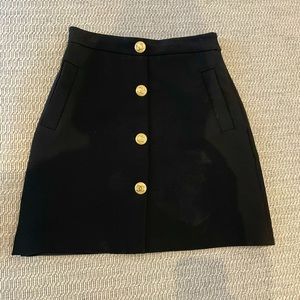 Black Chanel-style miniskirt